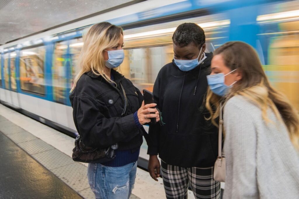 people on subway walk